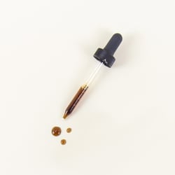 a dropper filled with a liquid supplement