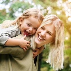 Someone smiling with their child
