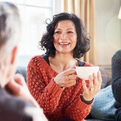 Supports a Healthy Gut – Woman enjoying a cup of tea with friends