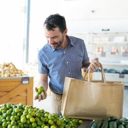 Someone shopping for vegetables