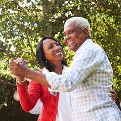Enhances Learning & Memory - Elderly couple dancing together outdoor under a tree