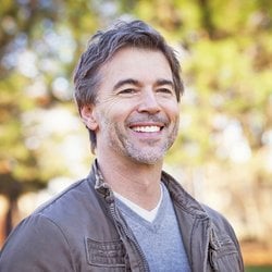 Essential for Total Wellness – Man smiling in the park